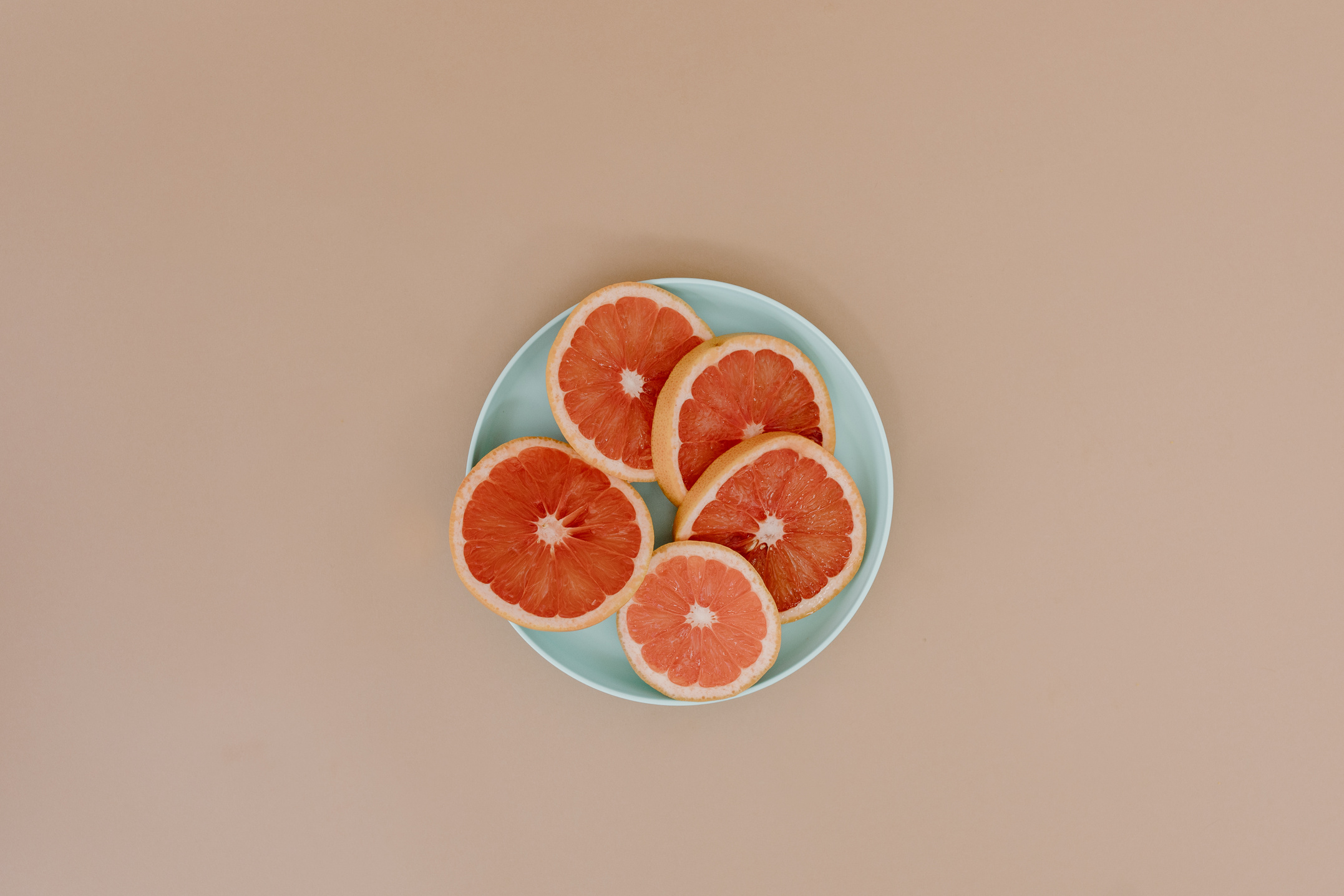 Sliced Grapefruit in a Ceramic Plate